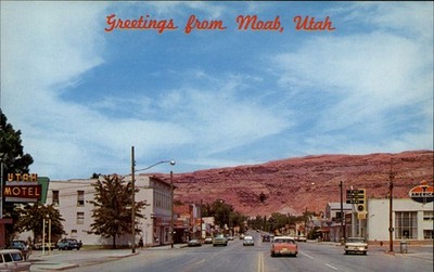 Moab UT Main Street Classic Cars Red Rock Cliffs postcard c197