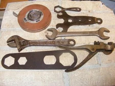 7 Old Tools, FORD, Strong Hit adjustable wrench, Saw Set, Evans 100' Tape, etc