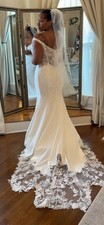 One of a kind unworn boutique wedding dress. Size 16