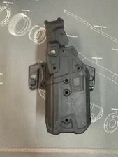Bladetech Taser 7 Left Hand Draw Holster. W/ Blackhawk STRIKE platform