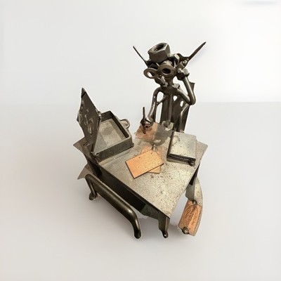Steelman24 lawyer business card holder sculpture made from nuts and bolts.