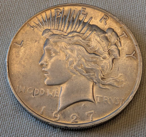 1927 $1 Peace Silver Dollar in About Uncirculated (AU)