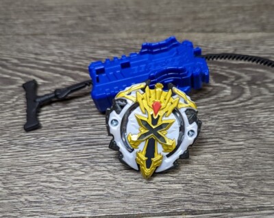 Beyblade Burst Evolution White Xcalius X2 Bey With Blue Launcher