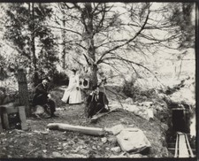 PHOTO OF PEOPLE TAKING TIMED PHOTO IN WOODS FROM NEGATIVE ON PHOTO PAPER