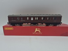 #6026 Hornby R4235 BR (ex LMS) corridor 3rd class coach `M1668M` in maroon.