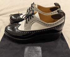 THE OFFICE OF ANGELA SCOTT Miss Lucy Derby Wingtip Platform Blk Whte Silver 39.5