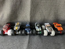 2015 Feld Motor Sports INC. Plastic Grave Digger Monster Jam Truck Lot Of 6
