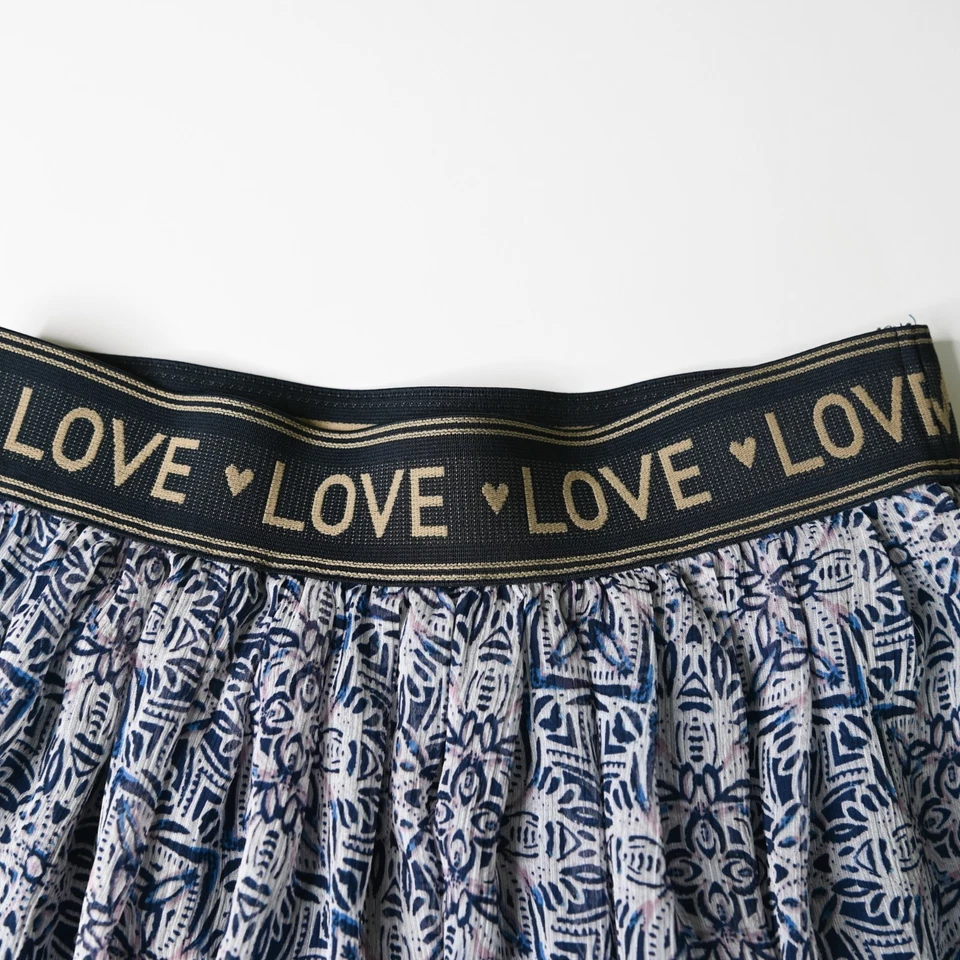 Minifalda plisada forrada de encaje azul Love de Jessica Simpson para niñas - talla grande Foto 3 de 4