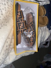 Fendi Pearland FF leather slide sandals in br...