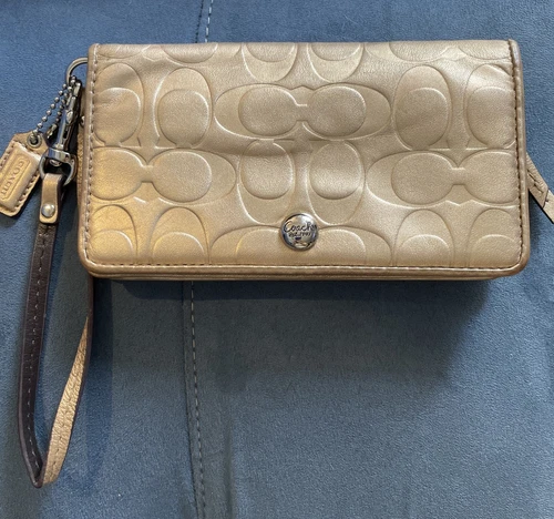 Portafoglio da polso Coach firmato in rilievo oro