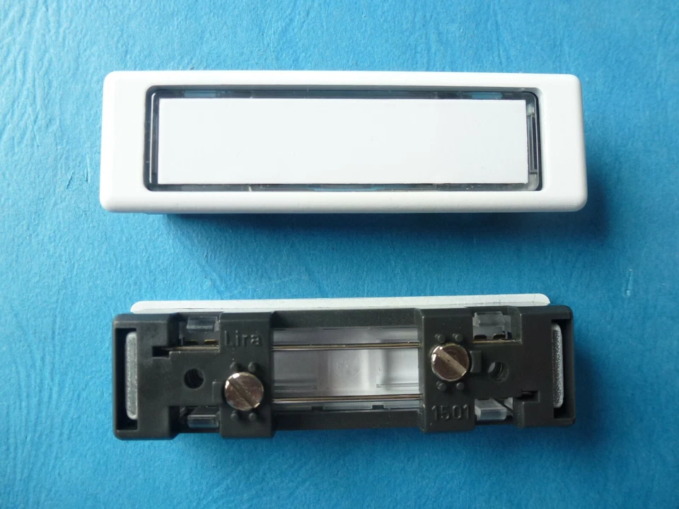 Klingeltaster mit Metallrahmen Lira NT 1500.9016, Aussenmaß 74,5 x 22 mm