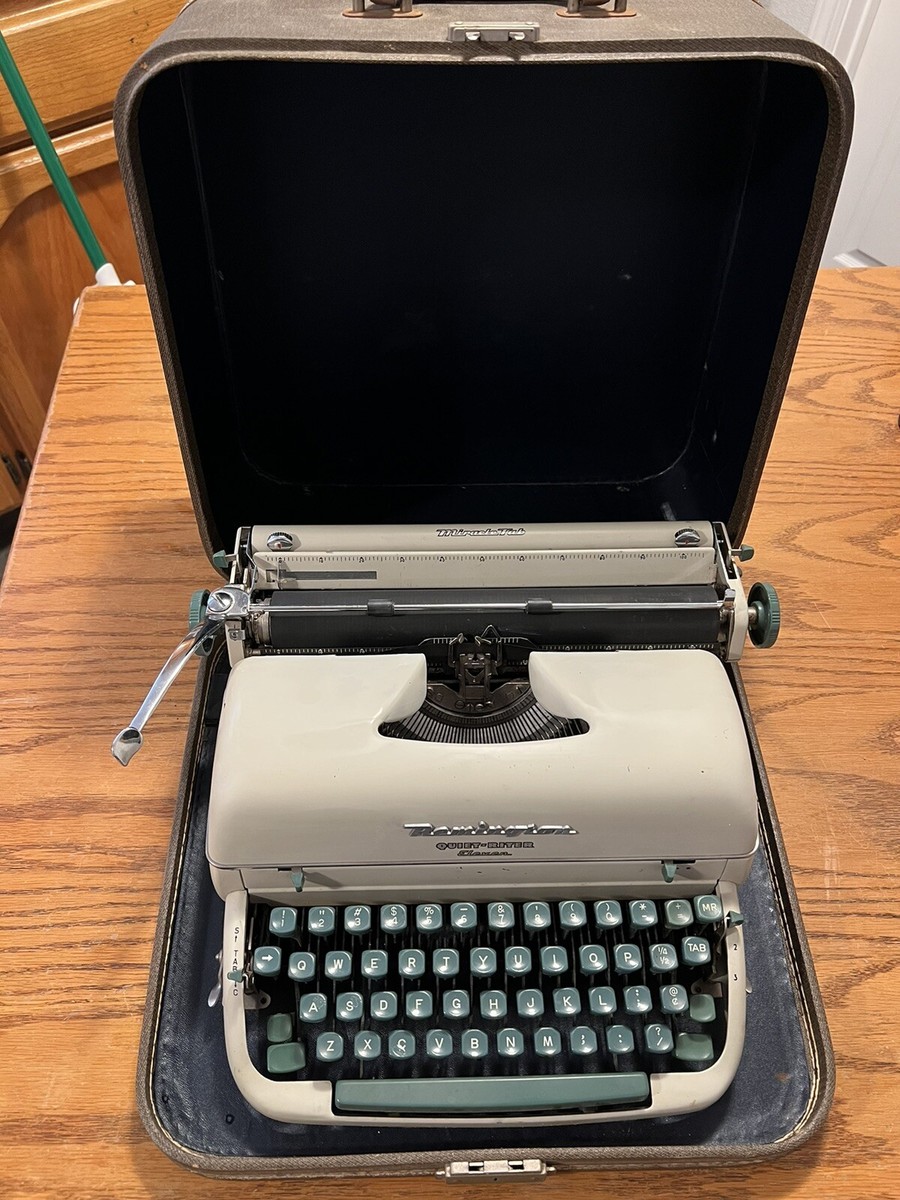 Vintage Remington Quiet Riter Typewriter w/ Case. None