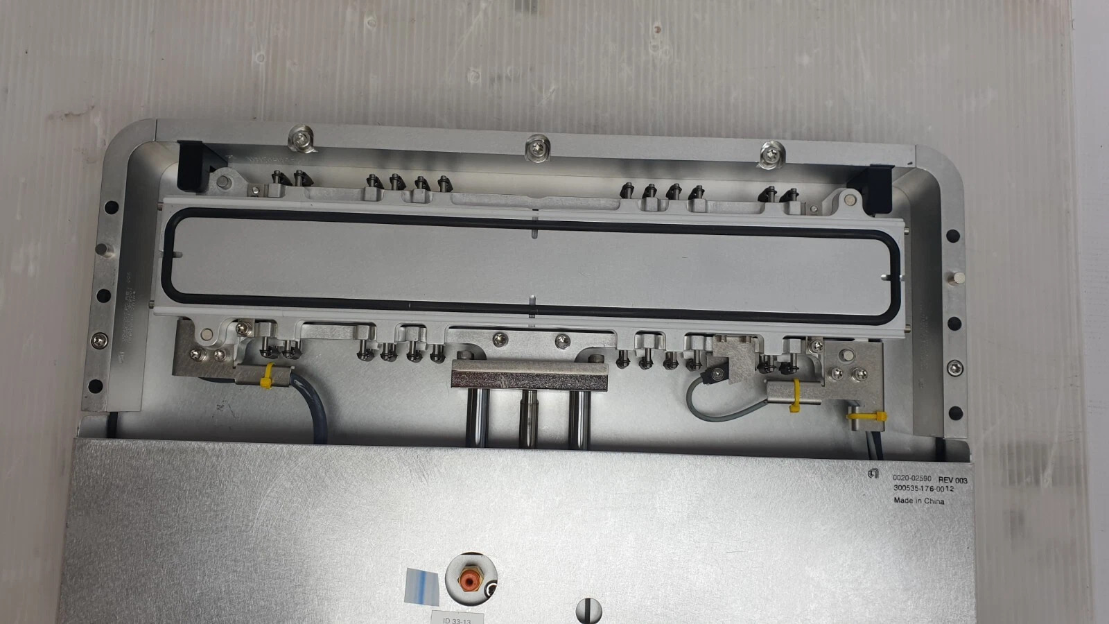 O-ring sealed door in its frame with the 0020-02590 REV 003 cover plate