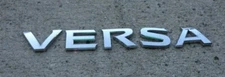 Nissan Versa SV emblem letters badge decal logo rear OEM Factory Genuine Stock