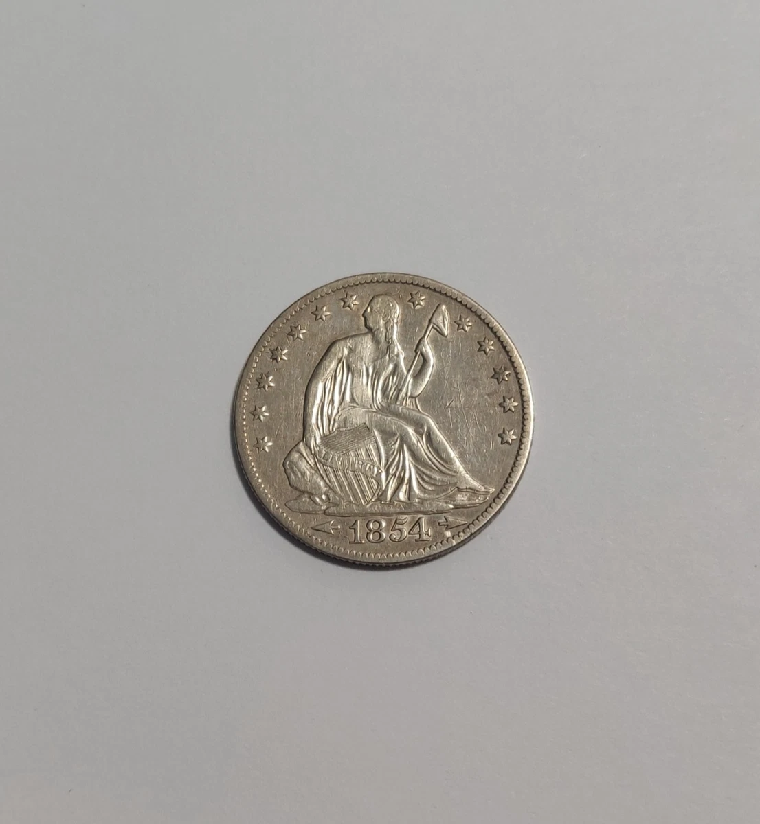 1854 Year Silver Seated Liberty US Half Dollars (1839-1891) for