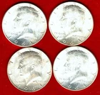 Four 1964 90% Kennedy silver half dollars