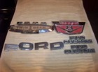 VINTAGE LOT of FORD COLLECTIBLES - BOOKS - EMBLEMS - BADGES, ETC. - TAKE A LOOK! — photo 1