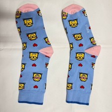 Light blue crew socks with a yellow character...