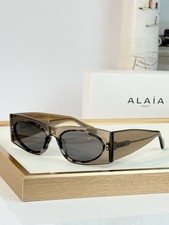 ALAÏA Paris AA0085S 002 Women’s Sunglasses Brown Crystal Grey Lenses 57-19-140