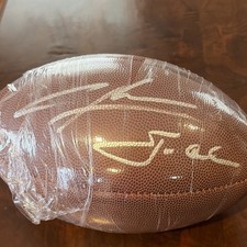 Charles Woodson i Jon Gruden podpisali kontrakt z Wilson Football. Certyfikat JSA 