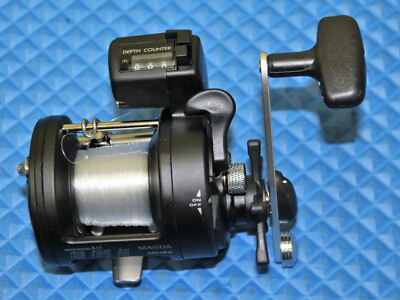 Okuma Magda Line Counter Trolling Reel Pre-spooled With15lb/180yd Mono MA 15D