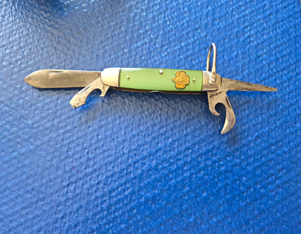 An official Girl Scout Kutmaster multi-tool with the original green handle — an impossibly charming piece of mid-century Americana that instantly sparks a story.