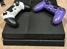 Sony PlayStation 4 Console with 2 Controllers and 2 Games
