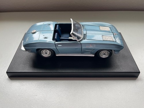 Vintage 1963 Blue Chevy Corvette Convertible with pedestal car model display