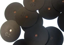 Laser drilled pinhole apertures