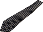 Hand made silk tie with black and white geometric diamond pattern, black tie with gold diamond shapes, on white background.