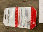 White Zippo box with red and black design, product details, and “Made in U.S.A.” text at bottom.