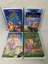 LOT OF 4 VHS TAPES IN CLAMSHELL CASE VARIOUS TITLES READ DESCRIPTION