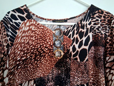 Size XL brown animal/reptile print dress, wooden rings at neck. Excellent cond