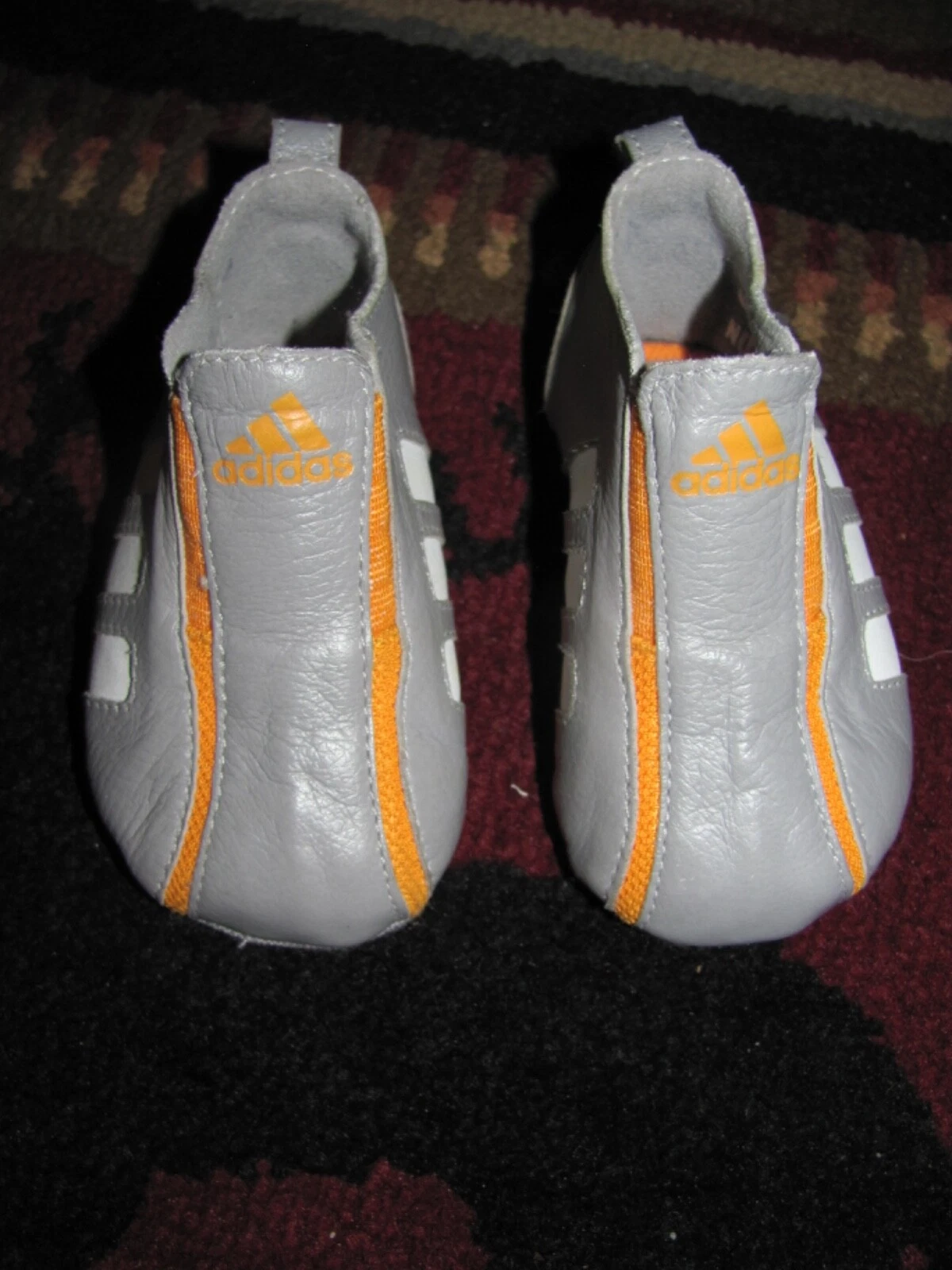 Scarpe Adidas grigio arancione pelle slip on tre strisce campione bambino neonato 1K