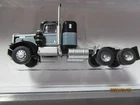 Trainworx # 49031 Kenworth W900 36" Seminole Black & Gray.  N-Scale