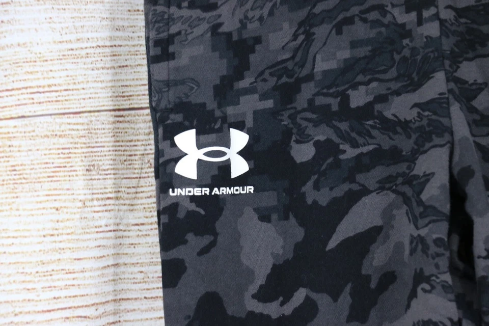 Pantalones deportivos Under Armour para niños jóvenes talla grande sueltos cónicos negros grises Foto 3 de 4