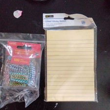 100 staples paper clips and dg lined sticky 