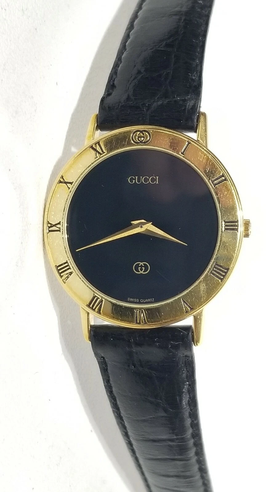 Montre vintage Gucci unisexe cadran noir plaqué or avec bracelet cuir noir