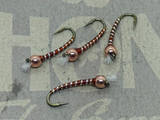 4ea. Silver and Rust Chironomids in sz. #12. Excellent still water pattern.