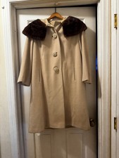 A vintage 1950s or 1960s beige wool or cashmere swing coat fur collar