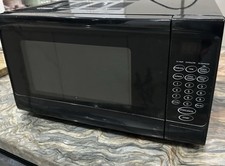 This is a black Cookworks 700W standard digital microwave 17L