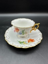 Meissen Porzellan Moccatasse mit Untertasse Blumen ziervergoldet mit Abplatzer