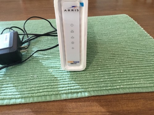 ARRIS White SURFboard Cable Modem Model SB6141 with power cord.