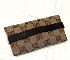 Custodia in tessuto con logo Gucci GG