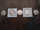 Five Franklin Half Dollars