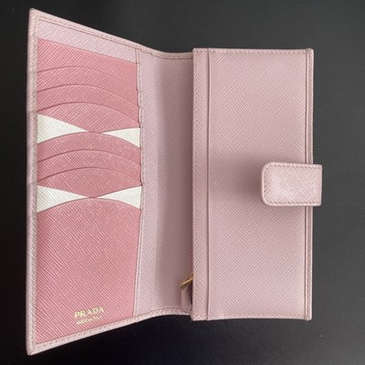 Pre-owned Prada pink bifold long wallet (1MV025) made of Saffiano leather.