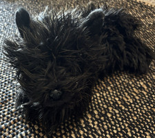 This collectible item is the Aurora 12-inch Toto plush, from The Wizard of Oz
