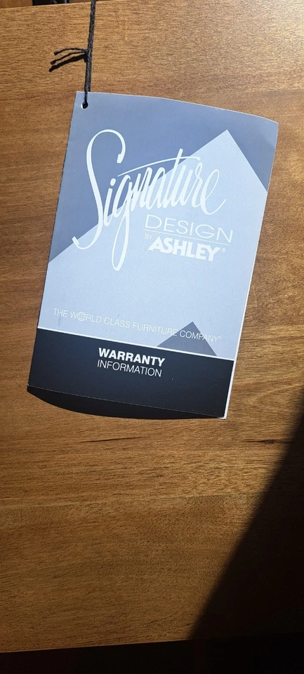 Mesa de centro elevadora marrón Signature Design by Ashley Torlanta Foto 2 de 4