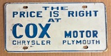1960's THE PRICE IS RIGHT AT COX MOTOR CHRYSLER PLYMOUTH BOOSTER License Plate