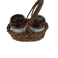 Salt and pepper shakers with basket